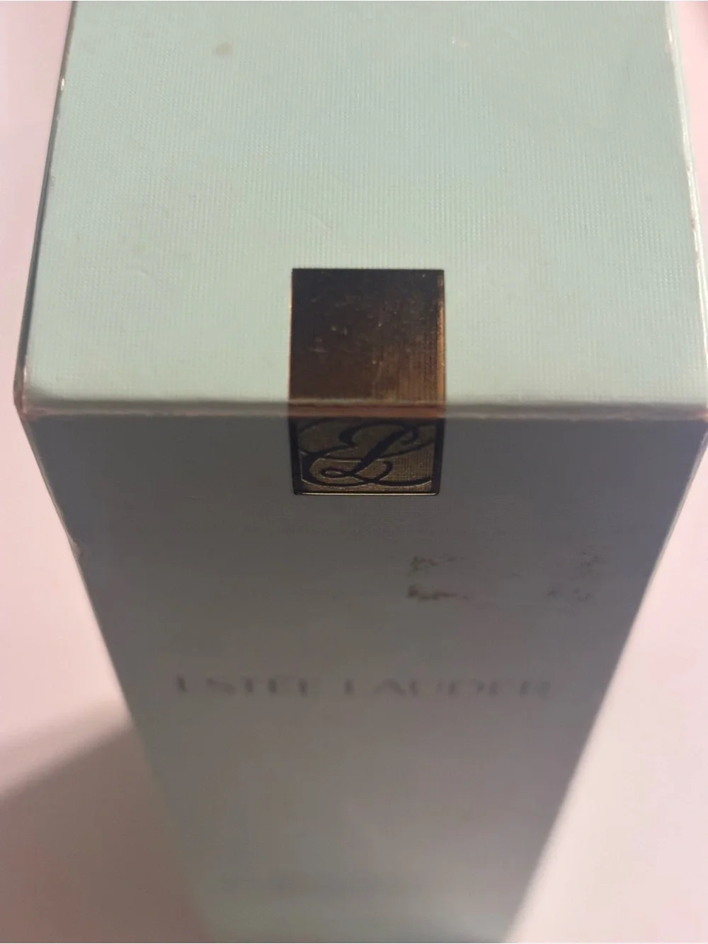 Estee Lauder Micro Essence Toner in Light Aqua and Gold Accent